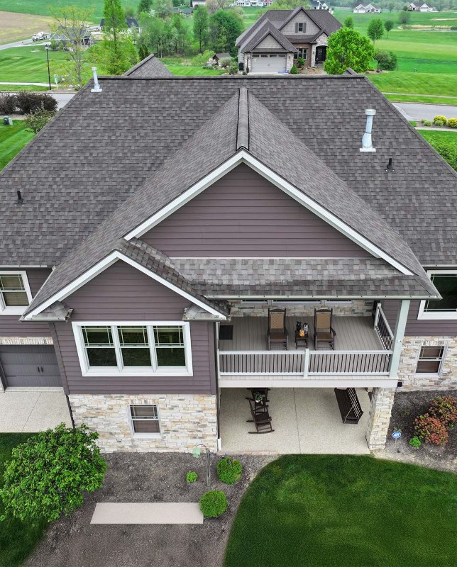 new gutters and downspouts on a house